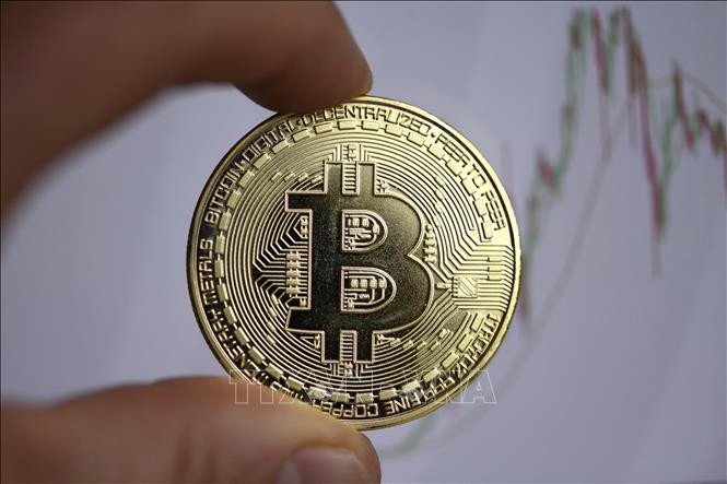 Đồng tiền kỹ thuật số Bitcoin. Ảnh: AFP/TTXVN Đồng tiền kỹ thuật số Bitcoin. Ảnh: AFP/TTXVN