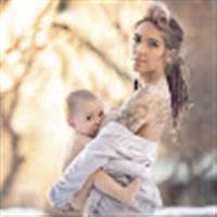 Beautiful Young Mom Breastfeeding